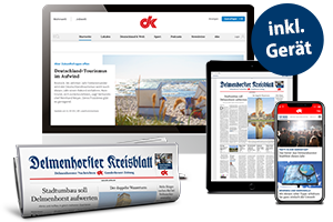 MacBook, iPad und iPhone mit Website dk-online.de und Zeitungsrolle
